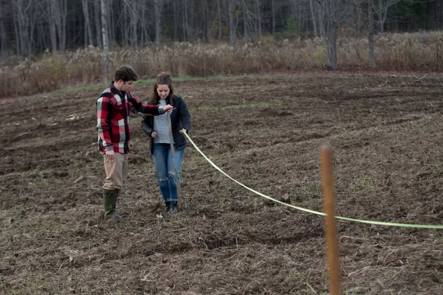 Students in ENVR 417/Community-Engaged Research in Environmental Studies, work with community partners at a farm on Old Webster Road in Lewiston, where members of the Somali Bantu Community Mutual Assistance Association of Lewiston/Auburn have been farming. Bates students are Dylan Thomas '18 of Monmouth, Maine, Drew Perlmutter '18 of NYC and Julia  Nemy '18 of San Francisco (ponytail).