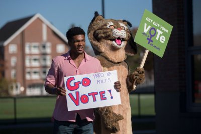 Election Day  Marcus Delpeche '17 of Wilmington, Del., and the Bates Bobcat encourage members of the Bates community to vote today. Inside Commons, students distributed information about six statewide ballot initiatives and recorded the number of students who had voted in today's election.