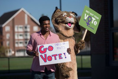Election Day Marcus Delpeche '17 of Wilmington, Del., and the Bates Bobcat encourage members of the Bates community to vote today. Inside Commons, students distributed information about six statewide ballot initiatives and recorded the number of students who had voted in today's election.