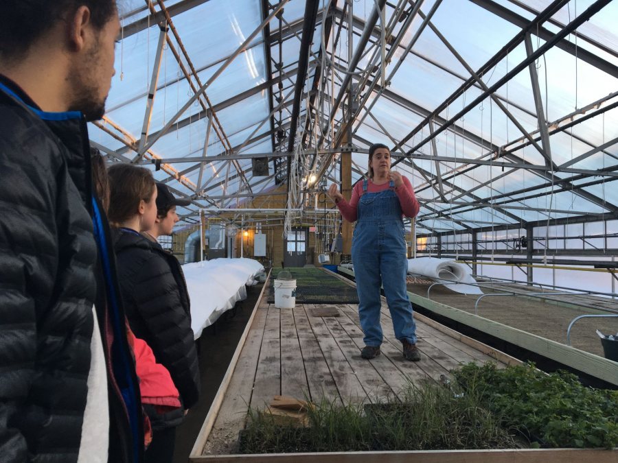 Students in Community-Engaged Research in Environmental Studies listen to Whiting Farm Director Kim Finnerty as they prepare for a semester-long feasibility study of a solar panel installation at the farm. 