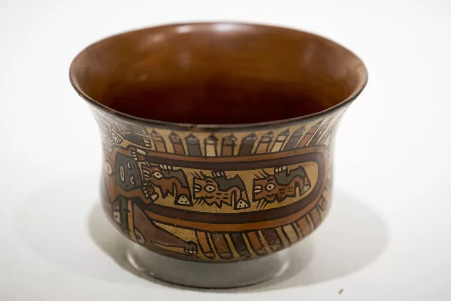 Historical Methods class, taught by Associate Professor of History Caroline Shaw, meets in the Lower Gallery of the Museum of Art in the Olin Arts Center. Working with Peter Philbin í22, assistant museum curator, the students broke into several groups to consider four works of art, and how they would use that artwork along with other pieces in the museum collection, to create an exhibition.

HIST 399 - Historical Methods
This seminar refines students' proficiency as historians and prepares them to write their senior thesis. The course is designed around two interrelated goals. First, students analyze how different approaches to history and sources matter to understandings of the past. Second, students design and test their own arguments, drawing upon critical readings of primary sources and close engagement with historiography. The course culminates in the completion of individual thesis proposals. Prerequisite(s): one HIST 301 seminar.

Students at table, from head of the table, left:

Hanna Matthews í24, brown sweater, long blonde hair
Matt Connelly í24, white shirt
Chris Ly í24, black hoodie
Emily Everett í24, light gray sweater
Bridget Lee í24, gray sweater, brown pants
Ben Fasciano í23, gray sweater
James Guinee í24,blue/green sweater
Ned Farrington í24, blue flannel
Sebastien Kleitman í24, black hat
Luke Linnehan í24, black baseball hoodie and hat
Campbell McKendry í24, black sweater, brown hat