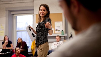 Assistant Professor of Education Mara Tieken circulates among small groups of students as they discuss what makes good teaching. Through fieldwork and classroom work, education students learn about the field’s interdisciplinary perspectives and the practical realities today.