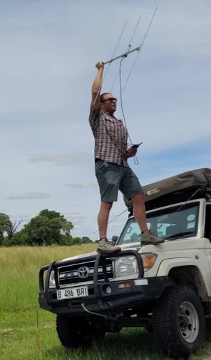 LeFlore tracking collared lions with radio telemetry equipment