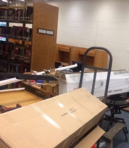 Construction materials blocking access to tables and book stacks.