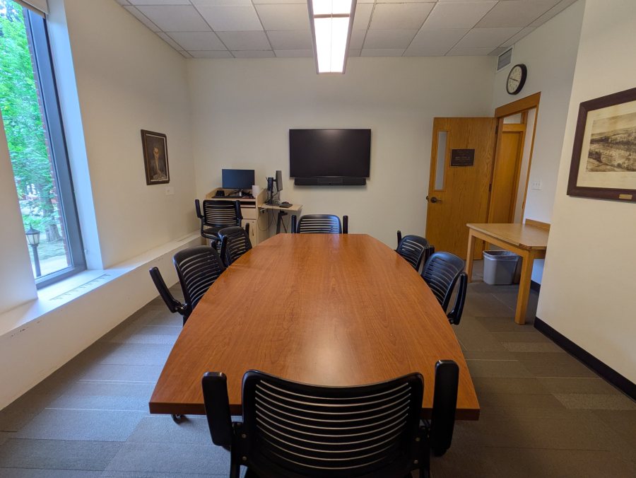 Conference table, 8 chairs, tv, computer