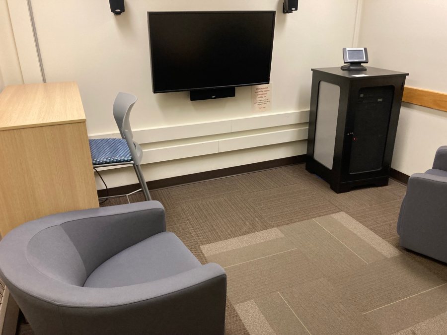 Study Room with four lounge chairs, high table, tall stool, tv, DVD/bluray, VHS