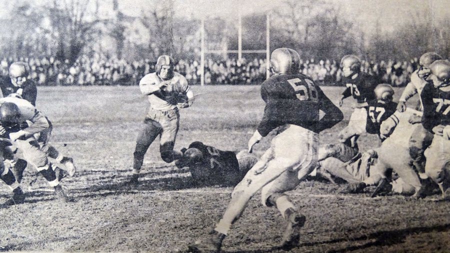 Art Blanchard '47 carries the ball during the Glass Bowl game on Dec. 7, 1946, between Bates and the University of Toledo.