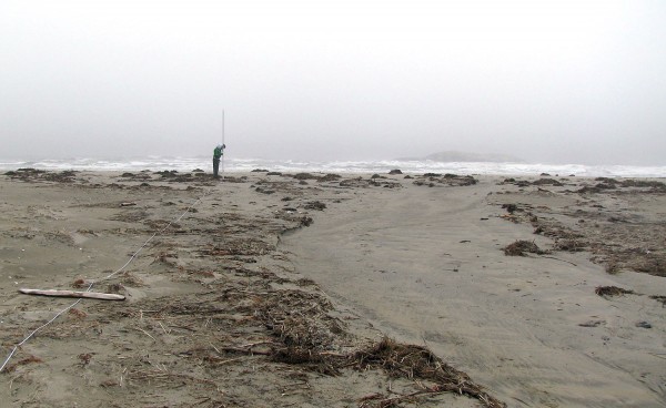 This seaward-looking view of the beginning of the new channel across the sand spit was taken on April 7, 2009. Note how the seaweed, wood and other debris have been cleared from the area of fastest flow. Photograph by Mike Retelle.