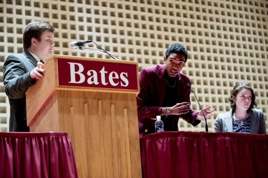 During the Benjamin Mays Debate, Harry Meadows ’19 listens as Zachary Manuel of Morehouse College offers a point of information. At right is Abby Westberry ’19. (Phyllis Graber Jensen/Bates College)