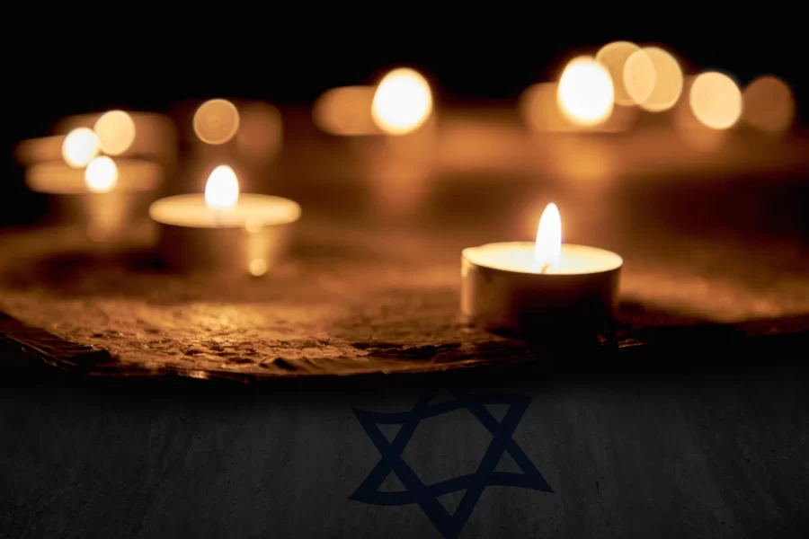 Candles burning over the Star of David in memory of the dead.
