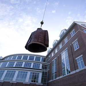 The Committee on Public Art announces the arrival of Sui JianguoÕsSculpture Legacy Mantle (Mao Jacket) on the Bates Walk. The work is on loan for one year.Sui Jianguo is considered one of the premier sculptures in China today and his work has been displayed in the pivotal international exhibitions of Chinese art in the past twenty years. These exhibitions include ÒMade in China,Ó ÒArt and ChinaÕs Revolution,Ó "New Art from China: post-89," ÒChina TradeÓ and ÒBeautiful Cynicism.Ó His series of Mao suits are considered icons of contemporary Chinese art. The iconic Mao jacket, emptied of its signature occupant, appears in a monumental scale draped in irony. The 4-ton metal jacket is 3 meters high, 2.5 meters wide, and 1.5 meters deep.Sui Jianguo received his MFA from the Central Academy of Fine Arts in Beijing. His studio is based in Beijing and he is a Professor and the Chair of the Central Academy Sculpture Department.Frank Toth of JC Super & Sons in Harrison, NJ, drove the Mao jacket up to Bates.Leo Castonguay, working on hooking up statue, and Jerry Castonguay, at wheel of the crane, manage moving the scultpture into place.