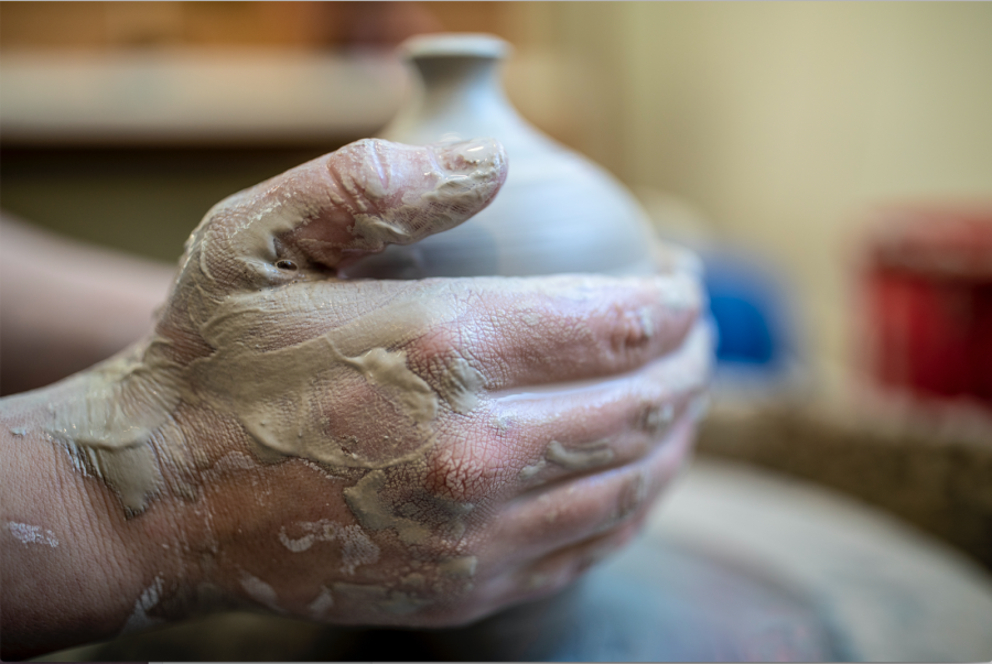 Celia Feal-Staub throwing a vessel, 2020, stoneware, photograph by Phyllis Graber Jensen