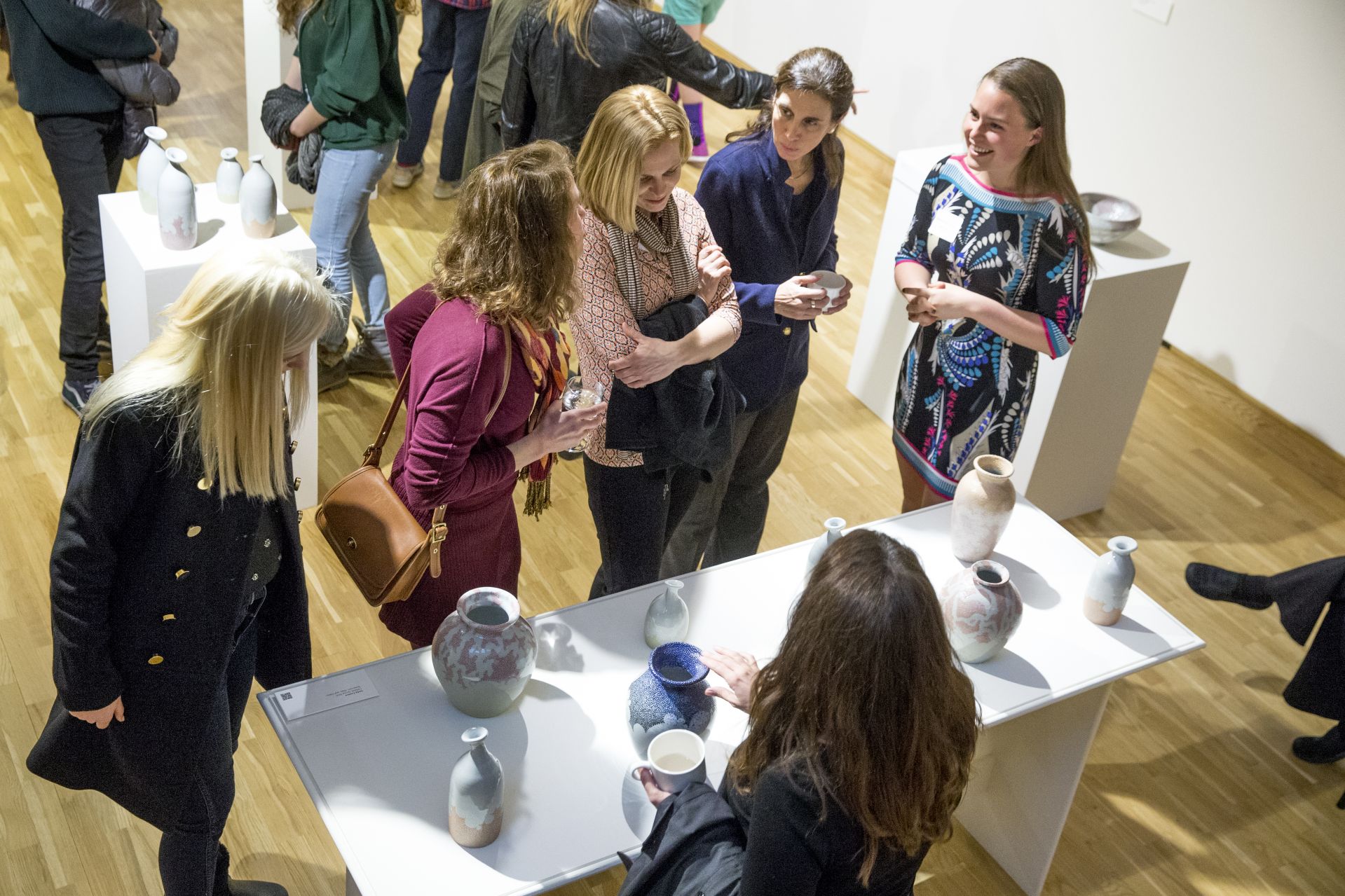 The 2016 Senior Thesis Exhibition and reception at the Bates College Museum of Art is filled with beautiful work and excited visitors The artists will be there to greet you! "Someone came in here and looked at our stuff and said 'you guys are really vibing off of each other.'"-- Sasha Lennon '16 of Cape Elizabeth, a double major in studio art and psychology (left) and Natalie Silver '16 of Bennington, Vt., a double major in studio art and history, throw pots for the Annual Senior Exhibition in their ground-floor Olin Arts studio. As co-coordinators of the Annual Entering Student Outdoor Program (along with classmate Jordan Cargill), they are close friends who share not only a studio but also an interest in the balance of form and function in their ceramic art. (Phyllis Graber Jensen/ Bates College)