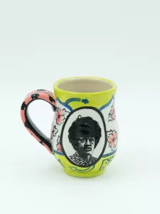 Roberto Lugo, Fighting Shirley Cup, 2023, stoneware, photo transfer, glazes, 4 ½ h x 5w x 3 ¼ dia. inches.