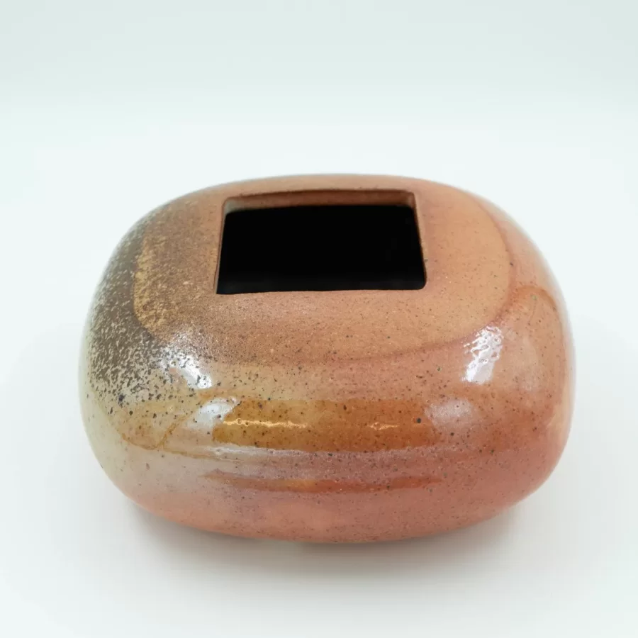David Shaner, Pillow Vessel with Square Opening, ca. 1985, stoneware, hand built, Shino glaze, wood fired, 4 ½  h x 9 ½  dia. inches.