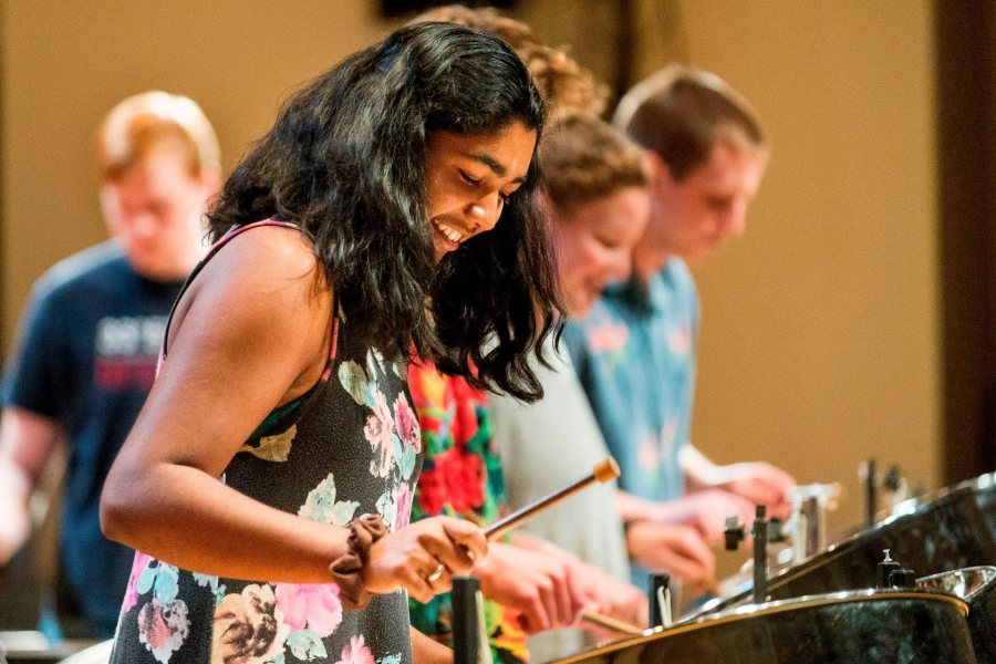 Zofia Ahmad '19 of Palo Alto, Calif. joins classmates for an encore at the Bates Steel Pan Orchestra concert.The Bates Steel Pan Orchestra, under the direction of Duncan Hardy, performs traditional West Indies arrangements in the Olin Concert Hall on Monday, Dec. 7th 2015.