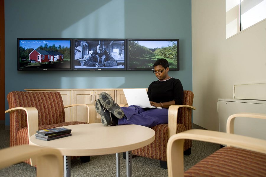 Views with a room: With a flatscreen video wall behind her, Jacqueline Smith '07 studies in the new Imaging Center. (Phyllis Graber Jensen/Bates College)