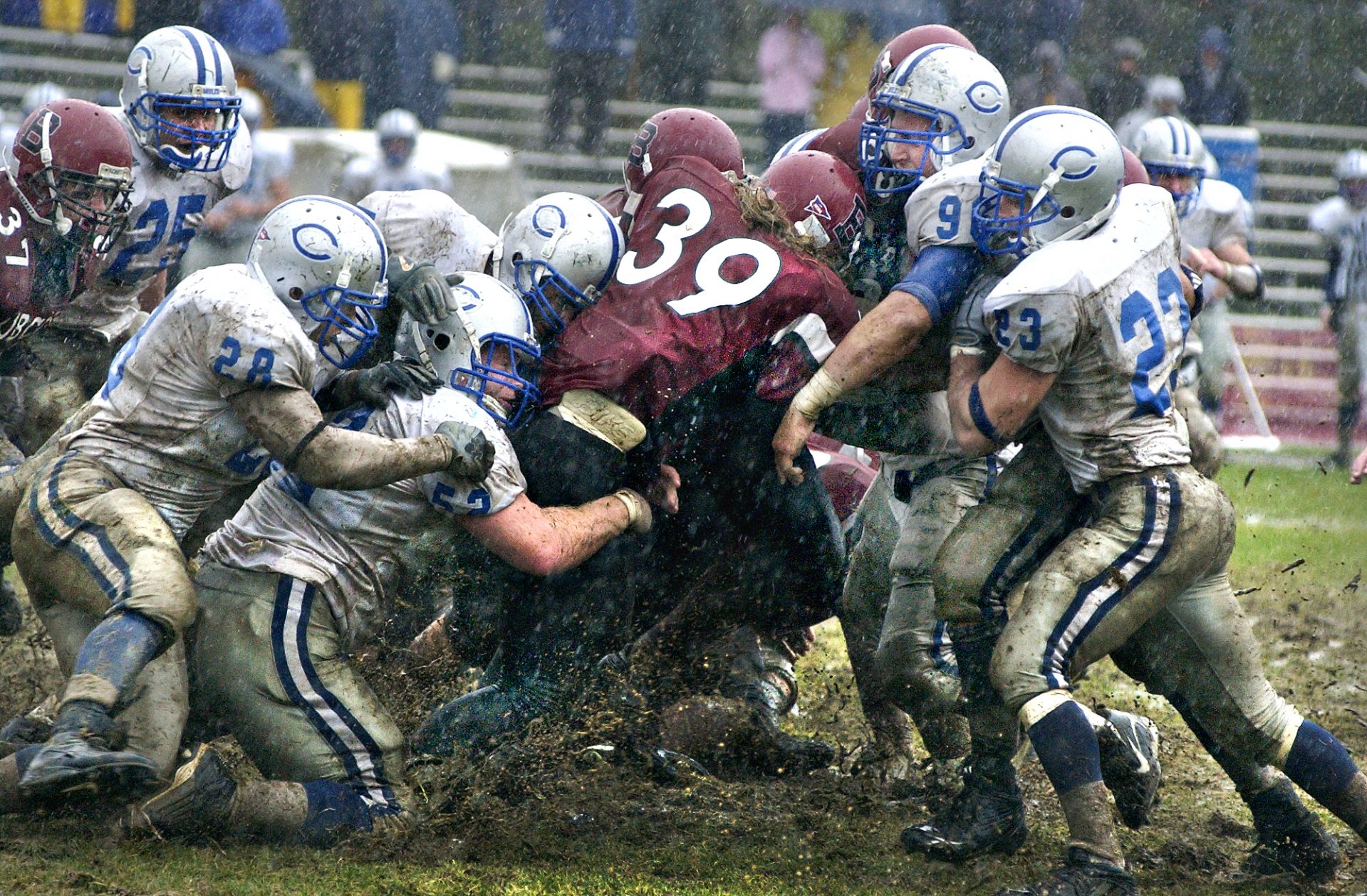 Bates senior Jamie Walker (Needham, Mass.), No. 39, carried the ball 43 times for a total of 135 yards in the Bates versus Colby College football game, Oct. 28, 2006, at Garcelon Field. Brian Bachow's 22-yard field goal in the fourth overtime period gave the Colby College football team a 10-7 victory over Bates College Saturday in the driving rain. Photograph by Daryn Slover.