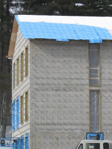 Sandwich generation: "Blueskin" weather barrier forms a layer of the roofing "sandwich" on the new student housing. (Doug Hubley/Bates College)