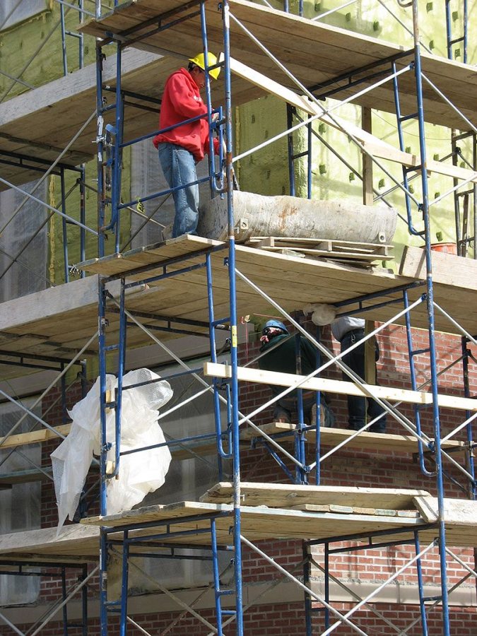 Mortar, boards: Bricklayers at work on the new student housing. (Doug Hubley/Bates College)