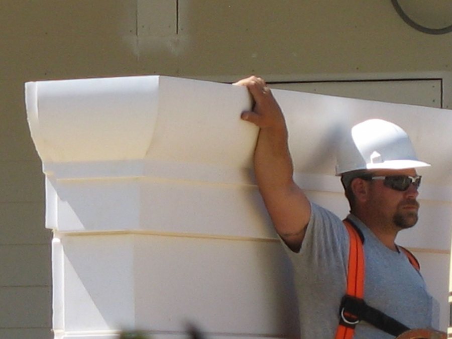 Steadying an end cap for the porch roof at 280 College. (Doug Hubley/Bates College)