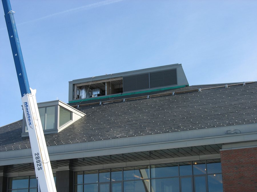 With two louvers in place on the new Commons' ventilation monitor, the crane has gone back for the next load. (Doug Hubley/Bates College)