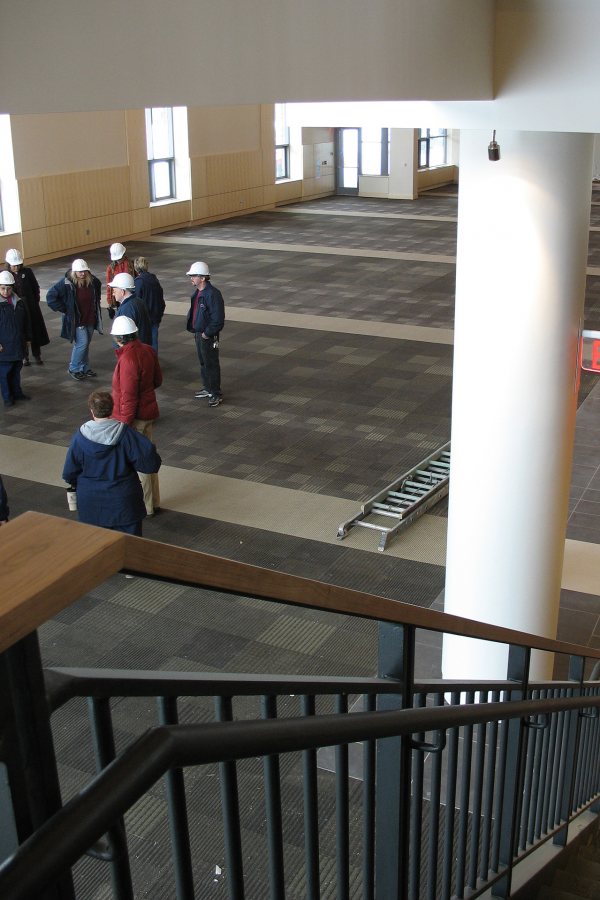 A staff-faculty tour group visits the main dining hall in the new Commons on Feb. 4. (Doug Hubley/Bates College)