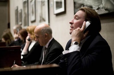 Joshua Holdeman '93 joined Christieâs New York as international director and head of the firmâs New York photographs department and of Christieâs New York 20th-century decorative arts department. He serves in both a managerial and international business-getting role, with focus on pursuing high-value property and single-owner collections.

Shown here working the phones with clients at the two-day New York  auction of "Icons of Glamour and Style: The Constantiner Collection," at 20 Rockefeller Plaza.
The collection features an extensive range of work of Helmut Newton and various other acclaimed photographers whose images portray high fashion models and glamourous celebrities (many of Marilyn Monroe), along with other assorted images.
Also shown at a auction for Tiffany's antiquities.

Auctioneer at Tiffany event and for the first Constantiner sale is Philippe Garner, international head of the international photography department, and Andrea Fiuczynski, in the second sale. Also shown, collector Leon Constantiner (black glasses, bald head) and art handler William Gregory.