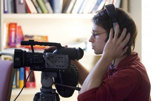 Independent digital filmmaker Craig Saddlemire '05 tapes an interview with roots musician Corey Harris '87 during the artist's weeklong residency at Bates. (Phyllis Graber Jensen/Bates College)