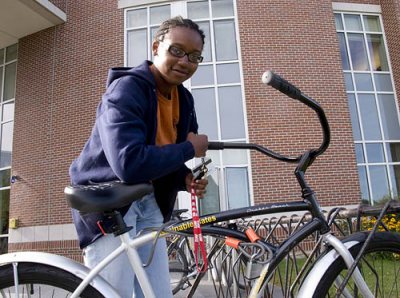 Bike Program Update:

#1   There are 25 bikes out on campus with "Sustainable Bates; A Community in Action" decals. This is a share program so please leave the bikes in a visible place for all participants to use.

#2   If you don't lock the bikes THEY WILL DISAPPEAR.

#3   Please direct all questions and/or comments to me at 786-8367 or jrosenba@bates.edu.

#4   The bike program is now full; we signed out 150 keys for 25 bikes. If these bikes are cared for & used responsibly, we'll add more next year.Cherelle Connor '13 of Miami, Florida, uses a Bates bike upon leaving Pettengill Hall. She enjoys using the bikes as a mode of transportation on campus, sees many using them, but has no trouble finding one when she wants one.