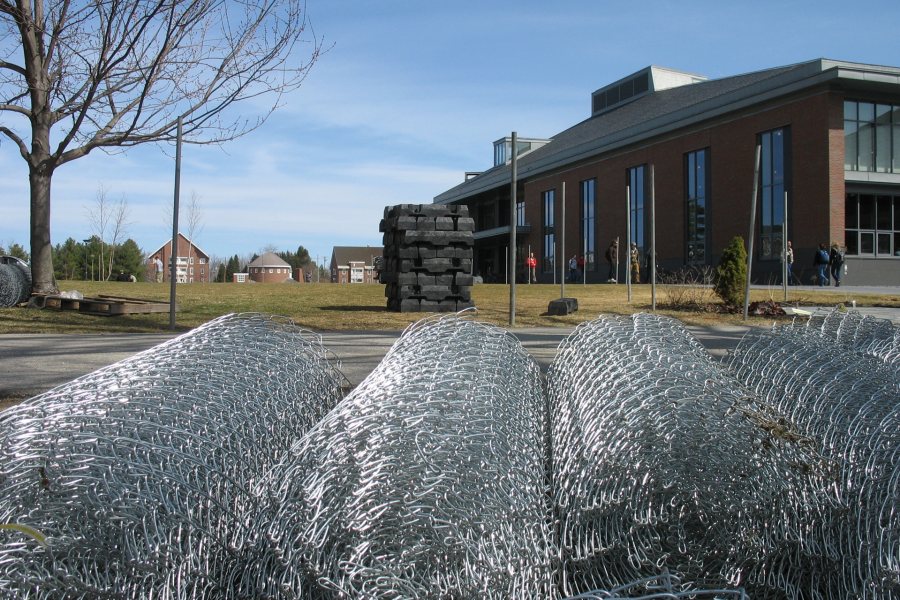 Rolls of chain-link fencing await deployment around the Roger Williams–Hedge halls construction zone on March 25, 2010. (Doug Hubley/Bates College)