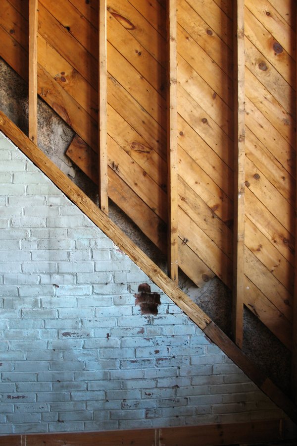 Former dormer: This interior image from March 2010 shows where a dormer joins the top of Hedge Hall. The dormer will be removed soon. (Doug Hubley/Bates College)