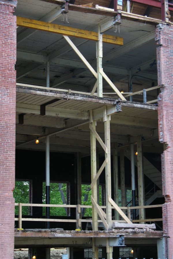 This rather startling hole in the north side of Hedge Hall will eventually accommodate a glass-sided stair tower. (Doug Hubley/Bates College)