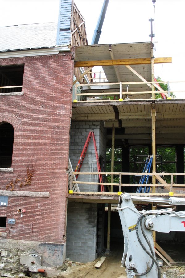 Going up: The new Hedge Hall elevator shaft is visible through a missing chunk of wall. (Doug Hubley/Bates College)