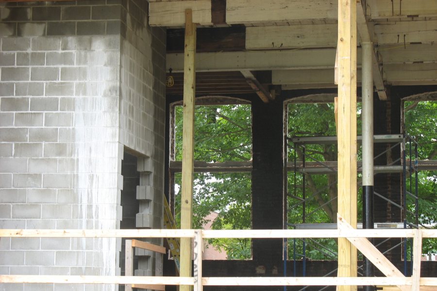 Surely you joist: The opening in the Hedge Hall wall reveals "sistered" floor joists and the concrete-block elevator shaft. (Doug Hubley/Bates College)