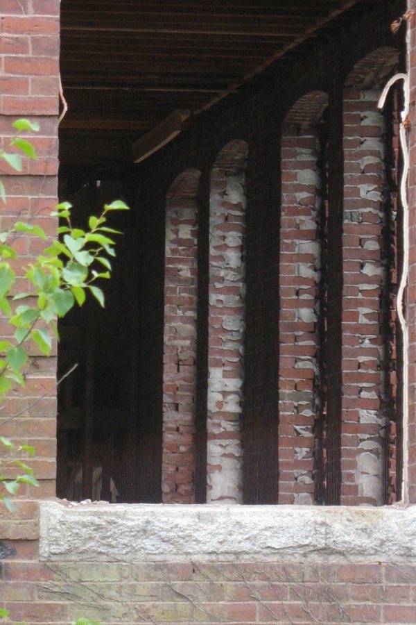 View to a Bill: A raw window opening affords a sight line into Roger Williams Hall. (Doug Hubley/Bates College)