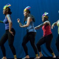 Culminating the college's Jan. 17 observances of Martin Luther King Jr. Day, students used music, dance, poetry and prose to survey the vast landscape of the African Diaspora, and their own diverse backgrounds, in an evening performance in Schaeffer Theatre.Titled Sankofa, a term from Ghana's Akan language referring to the idea of going back for what you have forgotten, the show emphasized the importance of remembering the past in order to appreciate the present and improve the future.Ashley Booker '12Ashley Booker '12 of New York City performs during the Poetry Slam.Reflecting the concept "Get Up, Stand Up: The Fierce Urgency of Now" -- the theme for this year's MLK Day programming at Bates -- the performers captivated audience members with their talent, pride and intensity. Fellow students, faculty and townspeople including members of the local Somali community filled the theater. The production, the first of its kind, drew hoots and hollers, laughter and tears from the audience.The production featured emotional readings, striking dance and uplifting music, displaying the talents of students from myriad backgrounds and disciplines. Directed by Linda Kugblenu '13 of New York City and produced by Cynthia Alexandre-Brutus of Brooklyn, N.Y., the production was as much a lesson in history and culture as entertainment.In one piece, actresses Omosede Eholor of New York City and Brittney Davis of Chicago, both first-years, performed Alexandre-Brutus' adaption of Sojourner Truth's speech "Ain’t I A Woman?" Rendered as a dialogue, the scene juxtaposed the inequalities facing black women in the 18th and 19th centuries with the modern context, a contrast heightened by stage lighting and costumes.In "Four Blast From the Past," four performers portrayed liberation movement leaders from across Africa. Raina Jacques '13 portrayed Yaa AsanteWaa, queen mother of the Asante confederacy. She vehemently delivered the speech that stirred the men of the community to fight