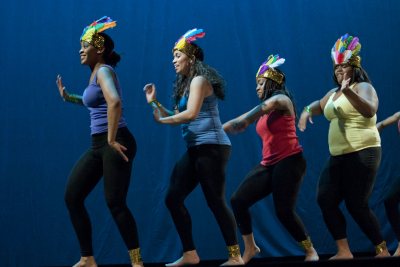 Culminating the college's Jan. 17 observances of Martin Luther King Jr. Day, students used music, dance, poetry and prose to survey the vast landscape of the African Diaspora, and their own diverse backgrounds, in an evening performance in Schaeffer Theatre.Titled Sankofa, a term from Ghana's Akan language referring to the idea of going back for what you have forgotten, the show emphasized the importance of remembering the past in order to appreciate the present and improve the future.Ashley Booker '12Ashley Booker '12 of New York City performs during the Poetry Slam.Reflecting the concept "Get Up, Stand Up: The Fierce Urgency of Now" -- the theme for this year's MLK Day programming at Bates -- the performers captivated audience members with their talent, pride and intensity. Fellow students, faculty and townspeople including members of the local Somali community filled the theater. The production, the first of its kind, drew hoots and hollers, laughter and tears from the audience.The production featured emotional readings, striking dance and uplifting music, displaying the talents of students from myriad backgrounds and disciplines. Directed by Linda Kugblenu '13 of New York City and produced by Cynthia Alexandre-Brutus of Brooklyn, N.Y., the production was as much a lesson in history and culture as entertainment.In one piece, actresses Omosede Eholor of New York City and Brittney Davis of Chicago, both first-years, performed Alexandre-Brutus' adaption of Sojourner Truth's speech "Ain’t I A Woman?" Rendered as a dialogue, the scene juxtaposed the inequalities facing black women in the 18th and 19th centuries with the modern context, a contrast heightened by stage lighting and costumes.In "Four Blast From the Past," four performers portrayed liberation movement leaders from across Africa. Raina Jacques '13 portrayed Yaa AsanteWaa, queen mother of the Asante confederacy. She vehemently delivered the speech that stirred the men of the community to fight