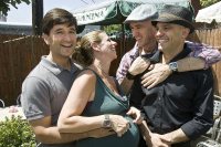 Back in 2010, the central figures in the <em>Bates Magazine</em> story about Rachell Segall '91 serving as a gestational carrier for her friends gather for a baby shower. From left, Tony Hurley
'91, Rachel Segall '91,
Erik Mercer '91, and
Sandro Sechi. (Lorenzo Ciniglio for Bates College).
