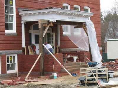 A mason works on the reconstruction of the historic porch on Roger Williams Hall on April 28, 2011.