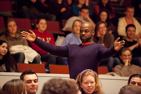 Marc Bamuthi Joseph engages with his audience in the aisles of the Olin Arts Center Concert Hall. (Photographs by Phyllis Graber Jensen)