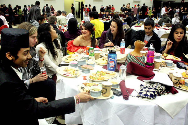 Happy diners think globally and eat locally at the 2012 International Dinner, held March 3 in the Gray Athletic Building. Photograph by Simone Schriger '14.