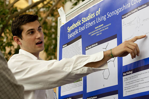 Travis Brown '11 of East Greenwich, R.I., explains his chemistry research at the 2011 Mount David Summit. Photograph by Phyllis Graber Jensen/Bates College.