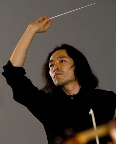 Hiroya Miura conducts the Bates College Orchestra.
