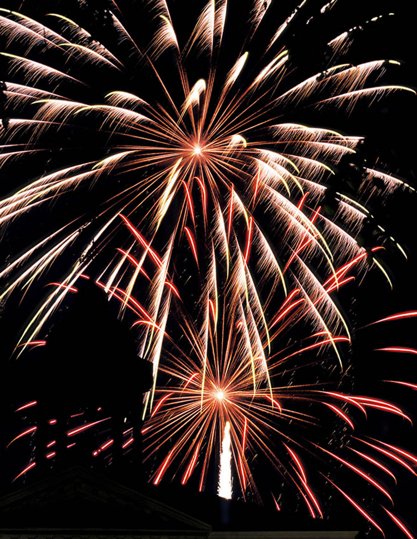 Hathorn Hall is silhouetted against a Bates fireworks display. Photograph by Ken Zirkel.