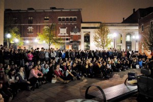 A Bates crowd at the Courthouse Plaza on Lisbon Street listens to the all-college a cappella performance that concluded the 2012 "College Night in Town." Photograph by Mikey Pasek '12.