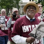 The Rev. Peter Gomes '65 is shown with members of his class during the Reunion parade in 2005. Photograph by Phyllis Graber Jensen/Bates College.