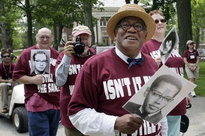 The Rev. Peter Gomes '65 is shown with members of his class during the Reunion parade in 2005. Photograph by Phyllis Graber Jensen/Bates College.