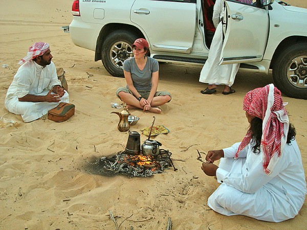 Anthropology major Devin Tatro '14 talks with Saudi men at a desert farm in the Eastern Province during a Short Term trip last spring to Saudi Arabia led by Dana Professor of Anthropology Loring Danforth. This was a rare moment in Saudi society: women talking with men publicly and allowed not to wear abayas. Photo: Ana Bisaillon ’12.