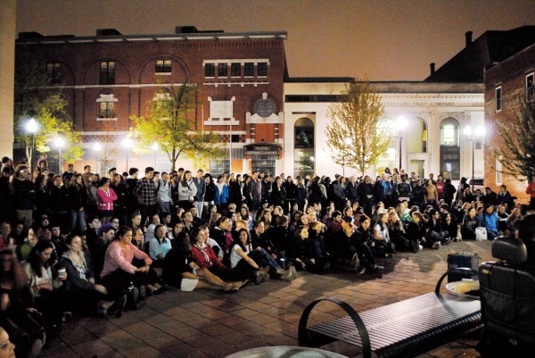 Batesies and fellow Lewiston-Auburn college students gather at the Courthouse Plaza on Lisbon Street for an a cappella performance that concluded “College Night in Town” in May. Photograph by event co-organizer Mikey Pasek ‘12.